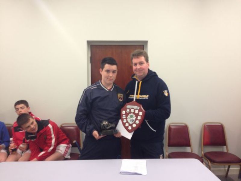 Niall Kearney presents Eoin Magee with the NA Feilé Skills Trophy 2013